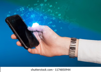 Hand using phone with cloud computing and online storage concept