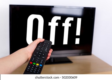 Hand Using A Remote Control To Turn Off The TV With An OFF Text On Its Screen