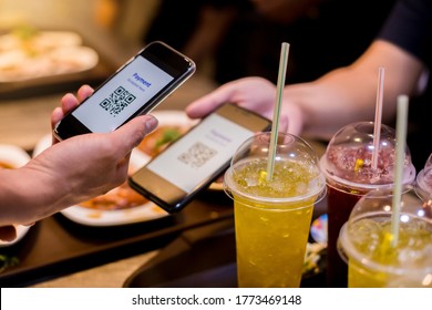 Hand Using Smart Phone To Scan QR Code On Tag With Blurry Food, Dessert And Customers In Restaurant To Accepted Generate Digital Pay Without Money. Qr Code Payment Concept.