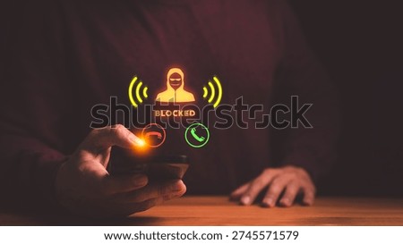 Hand using smartphone to block scam call. Cyber security protection against fraud, phishing, and hacker threats. Mobile phone user stopping spam.