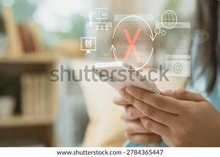 Hand using smartphone with cancel subscription interface, showing renewal stop, recurring billing, account management, monthly expense, and digital service control.
