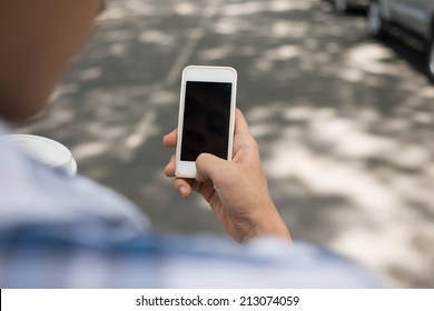 Hand Using Smartphone Outdoors