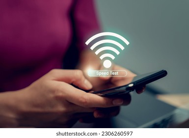 Hand using smartphone with showing WIFI speed test and loading bar for download software on internet or data form website. - Powered by Shutterstock