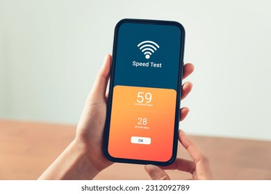 Hand using smartphone with showing WIFI speed test and loading bar for download software on internet or data form website. - Powered by Shutterstock