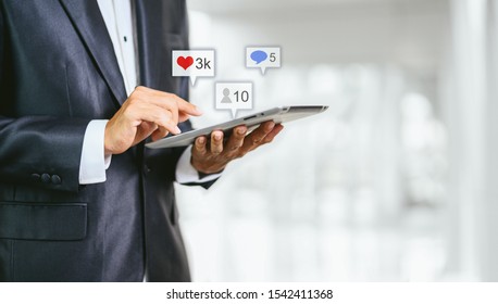 Hand using smartphone with Social media concept