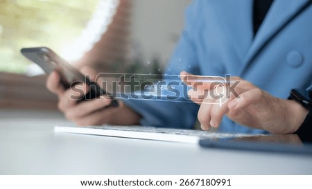 Hand using a smartphone and typing on a keyboard with a virtual job search bar. Concept of online job hunting, digital recruitment, and modern employment search tools.