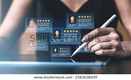 Hand using a stylus to interact with a digital interface displaying customer reviews, star ratings, and feedback icons on a blurred background. Concept of online reputation