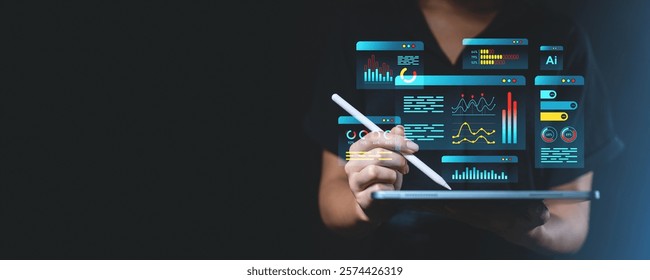 Hand using stylus on tablet with futuristic digital analytics interface, glowing data visualizations, charts, and graphs, technology concept