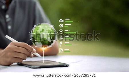 Hand using stylus on tablet with digital globe and environmental data bars. Tracking CO2, sustainability, and green performance metrics. Concept of ESG smart monitoring.