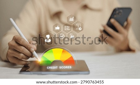 Hand using stylus on tablet with colorful credit score gauge from red to green, hexagon factor icons, and smartphone, representing financial health assessment, creditworthiness, and personal finance concept.