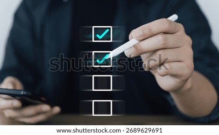 Hand using stylus to select on a floating digital checklist, symbolizing task completion or planning.