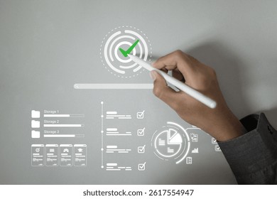 A hand using a stylus to tap on a digital fingerprint icon with a green check mark, symbolizing biometric verification or secure login.