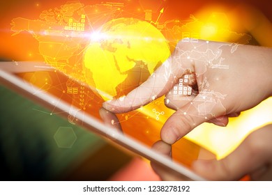 Hand using tablet with multinational worldwide estate report concept