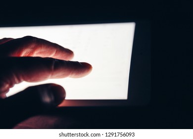 Hand Using Touch Screen Tablet Business Computer At Night