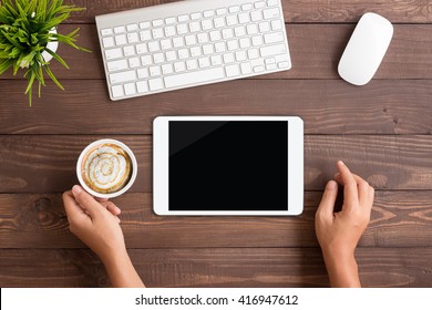 Hand Using White Tablet Blank Screen On Table Workspace