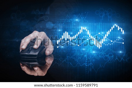 Hand using wireless mouse with statistical concept on dark background