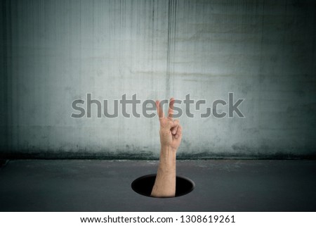 Similar – Image, Stock Photo Child hand reaches through a hole in a concrete wall