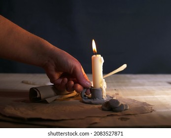 Hand with vintage candle with parchment paper medium shot