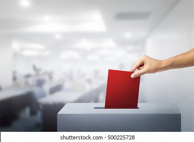 Hand Of Voting Red Ballot With Box