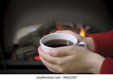 Hand warming at a fireplace