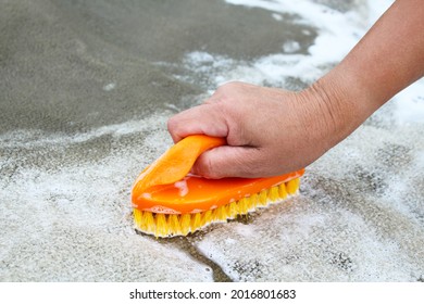 Hand wash carpet with a brush. Washing the carpet. Close-up. Background. Texture. - Shutterstock ID 2016801683