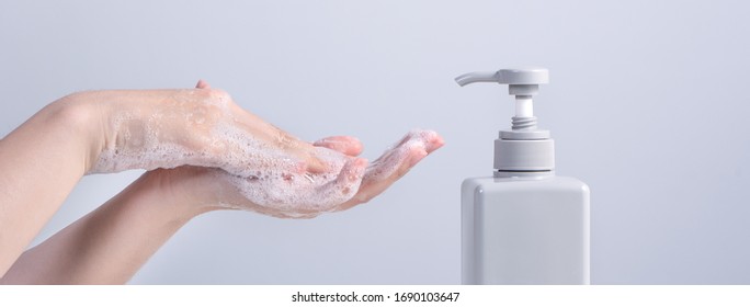 Hand Washing. Asian Young Woman Using Soap To Wash Hands, Concept Of Hygiene To Stop Spreading Coronavirus Isolated On Gray White Background, Close Up.