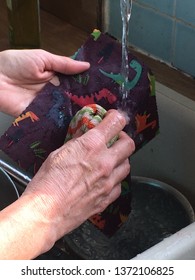 Hand Washing A Beeswax Food Wrap Under The Tap