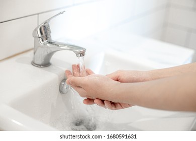 Hand washing to prevent corona virus for hygiene to stop the spread of the corona virus - Shutterstock ID 1680591631