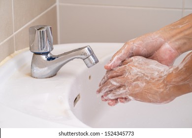 Hand washing with soap foam - Shutterstock ID 1524345773