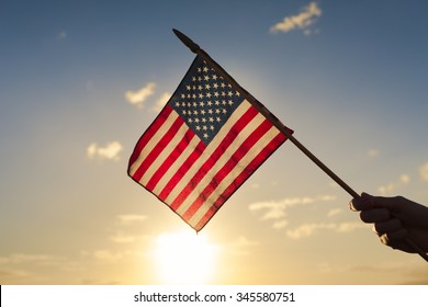 Hand waving american flag. 