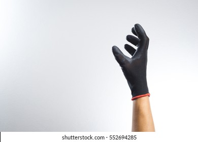 A Hand Wearing Black Glove With Action Gesture