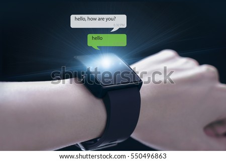 Hand wearing smartwatch. A smartwatch is a wearable computing device that closely resembles a wristwatch or other time-keeping device.