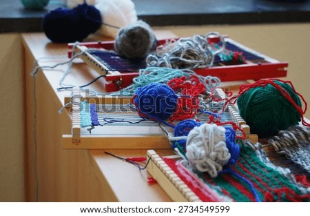 Hand Weaving Textile Workshop in a School. Wool Threads and Equipment for Old Simple Technology on a Table.