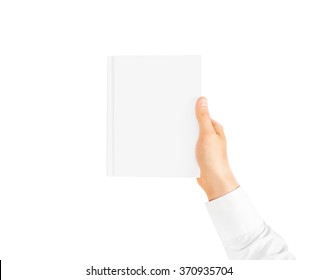 Hand In White Shirt Sleeve Holding Closed Blank Book Cover Mockup In The Hand. Vertical Catalogue Template Mock Up Hold In Arm. Clear Surface Booklet Notebook Cover Presentation. Textbook Catalog.