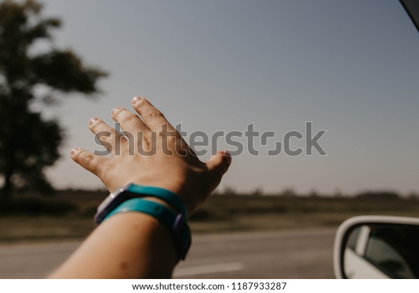 Hand in the window in the\
car