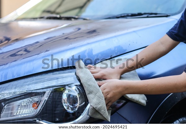 Hand wipe the car\
body using chamois rag