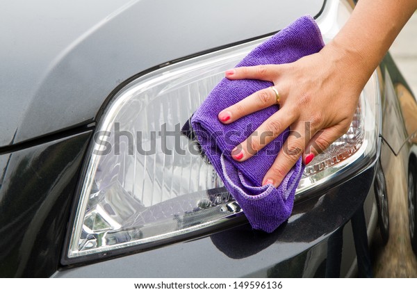 Hand with a wipe the car\
polishing 