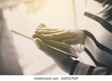 Hand Woman Cleaning Smart Phone On Screen With Microfiber Cloth,black And White Toned