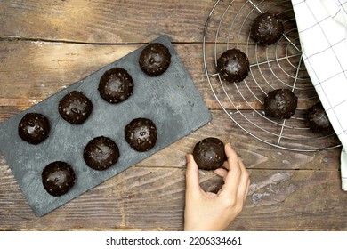 Hand Woman Holding Homemade Chocolate Biscuit On Wood Table