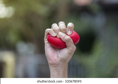 Hand Of A Woman Holding A Stress Ball