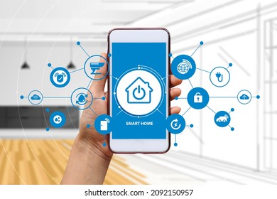 Hand of woman or man holding smartphone in house with icons in modern life internet of things, smart home technology. concept of automation. the new innovation of the future in living room. - Shutterstock ID 2092150957