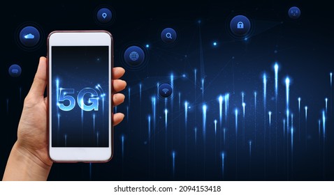 Hand of woman or man holding smartphone use 5G network wireless systems and internet of things with man touching with wireless high-speed Internet communication network background. - Shutterstock ID 2094153418