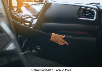 Hand Woman Open Glove Compartment Box In Car