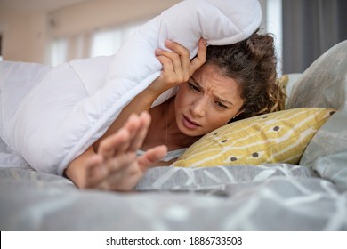 Hand Of Woman Turn Off Alarm On Call Mobile Phone While Wake Up After Sleep Relax In Good Morning At Bedroom. Woman Sleeping In Bed Being Woken By Mobile Phone