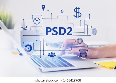 Hand of woman using laptop in blurred office or at home with double exposure of online shopping interface and PSD2 text. Concept of online payment and ecommerce. Toned image - Shutterstock ID 1465419908