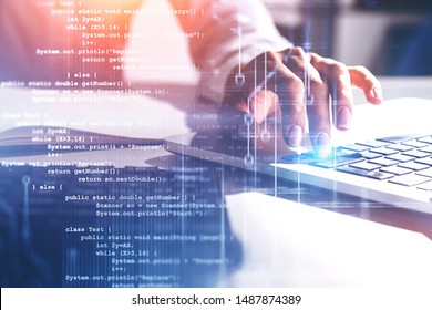 Hand of woman in white typing on laptop in blurred office with double exposure of lines of code. Concept of programming. Toned image - Shutterstock ID 1487874389