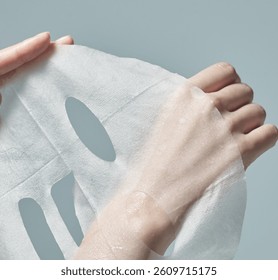 The hand of the woman who is opening the mask pack