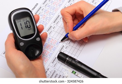 Hand Of Woman Writing Data From Glucometer To Medical Form, Result Of Measurement Sugar, Concept Of Measuring Sugar Level