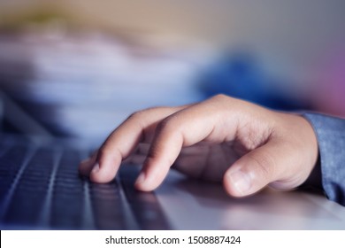 Hand of worker typing on the keyboard office.