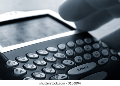 Hand working a hand-held device, closeup